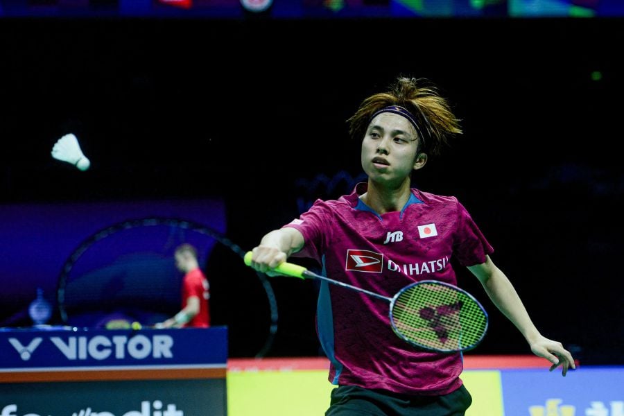 Japan's Kodai Naraoka hits a return to Germany's Kai Schaefer during their men's singles group stage match at the Thomas and Uber Cup badminton tournament in Chengdu, in China's southwest Sichuan province on April 29, 2024. - AFP pic