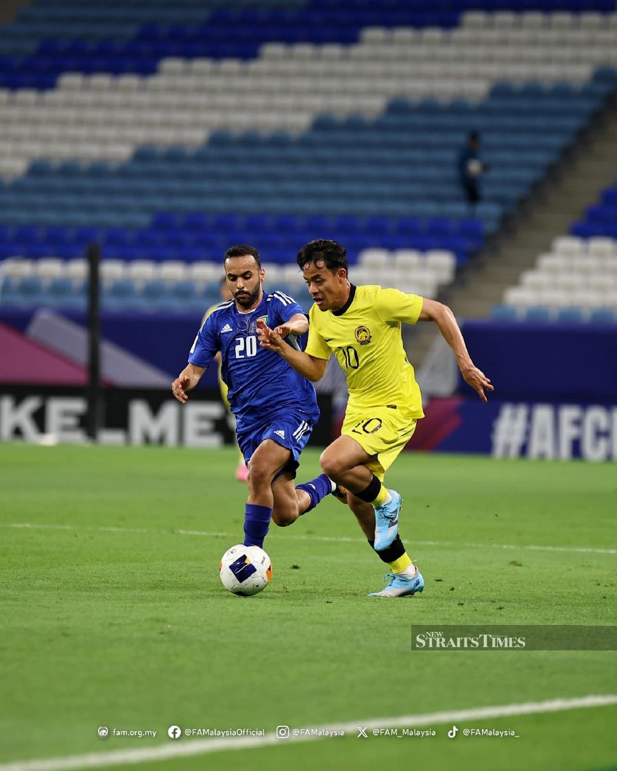 Malaysia’s Luqman Hakim Shamsudin (right) trying to get past Kuwait's Moath Al Enezi in an Under-23 match in Doha. Pic from FAM 