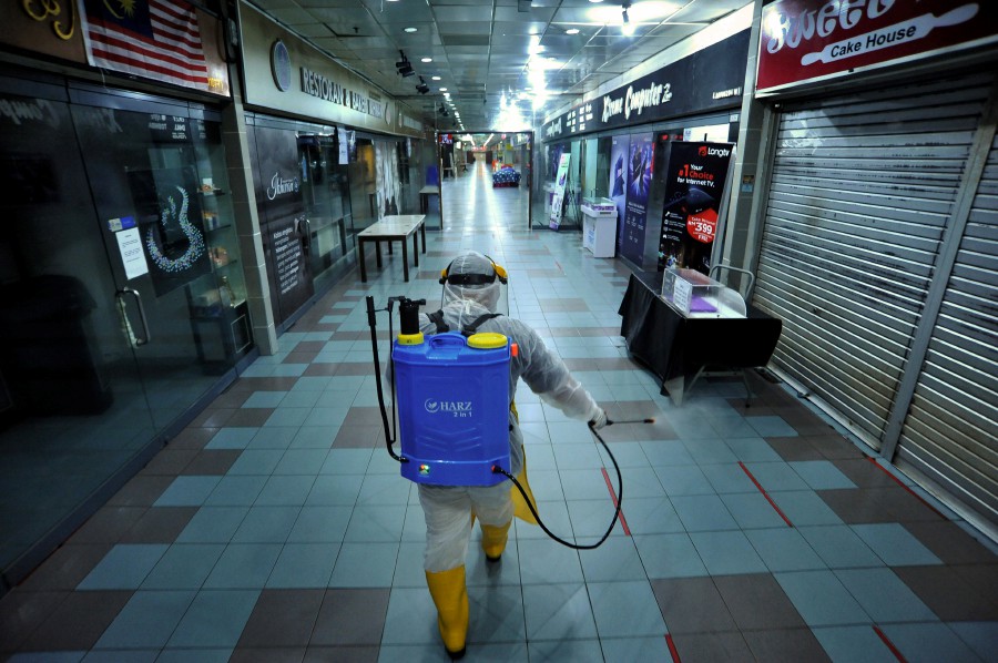 The Labuan Financial Park (FP) Emergency Respones Team (ERT) member seen in full personal protective equipment (PPE) conducting a disinfection process at the Labuan FP Complex today.The Labuan FP Complex ordered temporary closure beginning today after several workers had tested positive for COVID-19. - Bernama pic