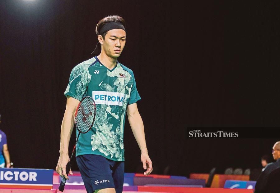The world No. 10, who won the title in 2021, lost 20-22, 21-16, 21-19 to India’s world No. 18 Lakshya Sen in a tight battle at the Utilita Arena in Birmingham. - NSTP/ASWADI ALIAS