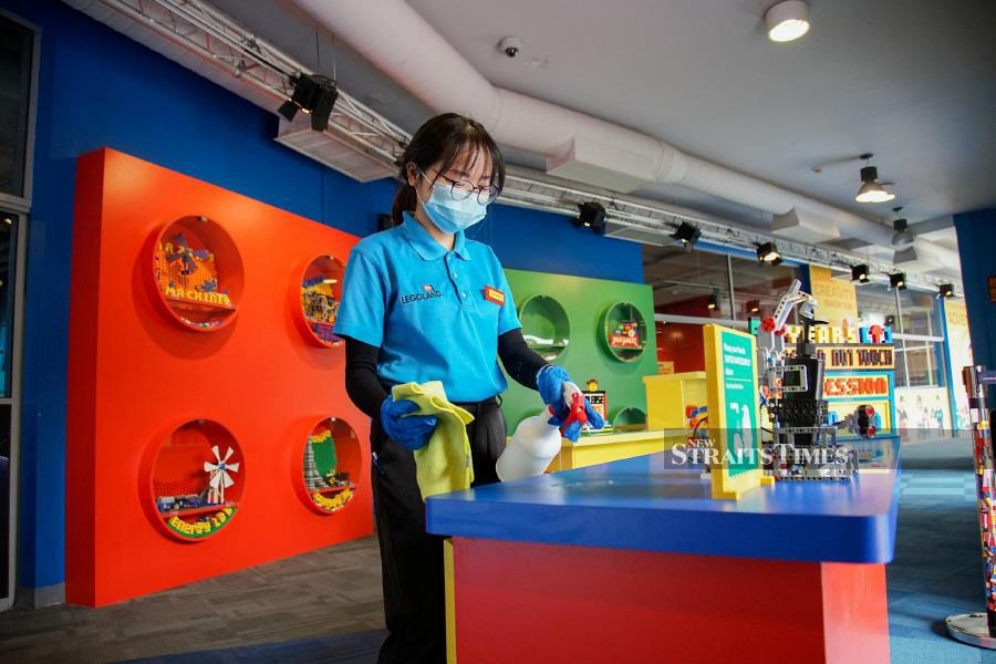 Legoland Malaysia Resort Team member preparing their stations in anticipation of reopening.