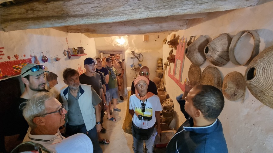 European tourists, escorted by security personnel, visit the old town of Ghadames, a desert oasis some 650 kilometres (400 miles) southwest of the Libyancapital Tripoli, on October 19, 2021, during an organised tour in the town. - In the first organised visit of European tourists to Libya since 2012, a private Libyan agency arranged the visit of tens of tourists to Ghadames and various sites in the Libyan desert. - AFP pic