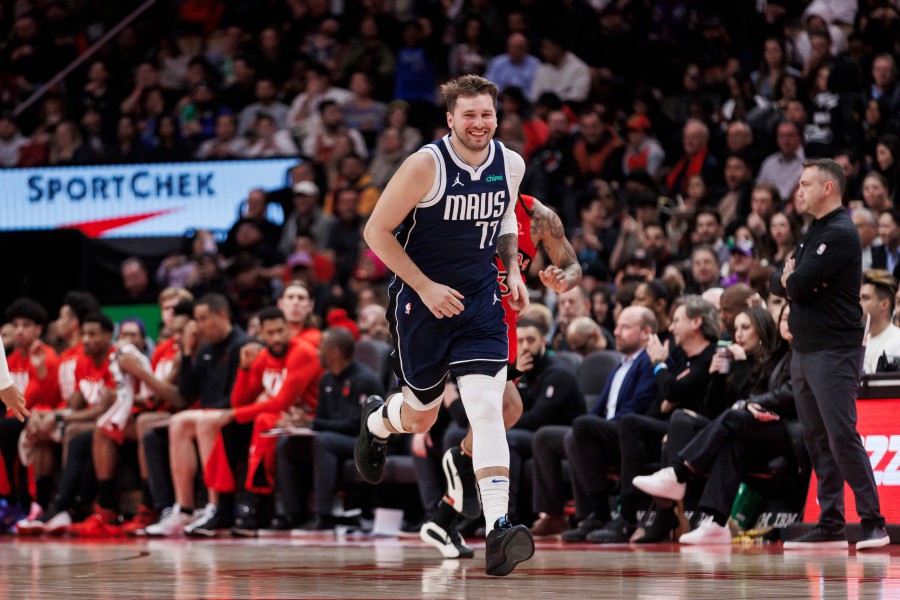 Luka Doncic #77 of the Dallas Mavericks smiles as he runs back on defense against the Toronto Raptors in the second half of their NBA game at Scotiabank Arena in Toronto, Canada. - AFP pic