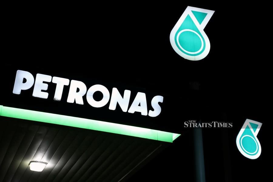 Petronas logos are pictured at a fuel station in Kuala Lumpur, Malaysia. REUTERS/Lim Huey Teng