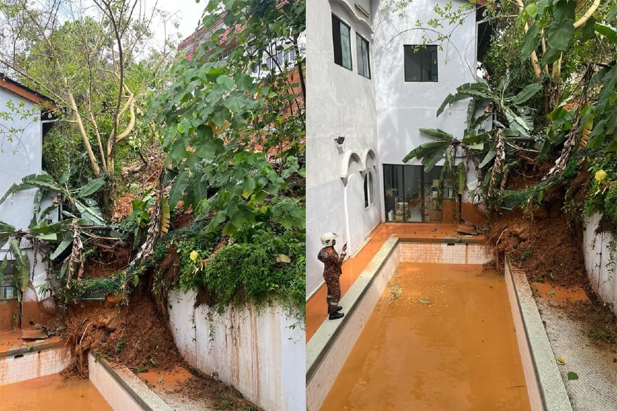 A landslide occurred behind a housing unit in Taman Bukit Pantai due to a water drainage leak from an upper house unit's swimming pool. - Courtesy pic