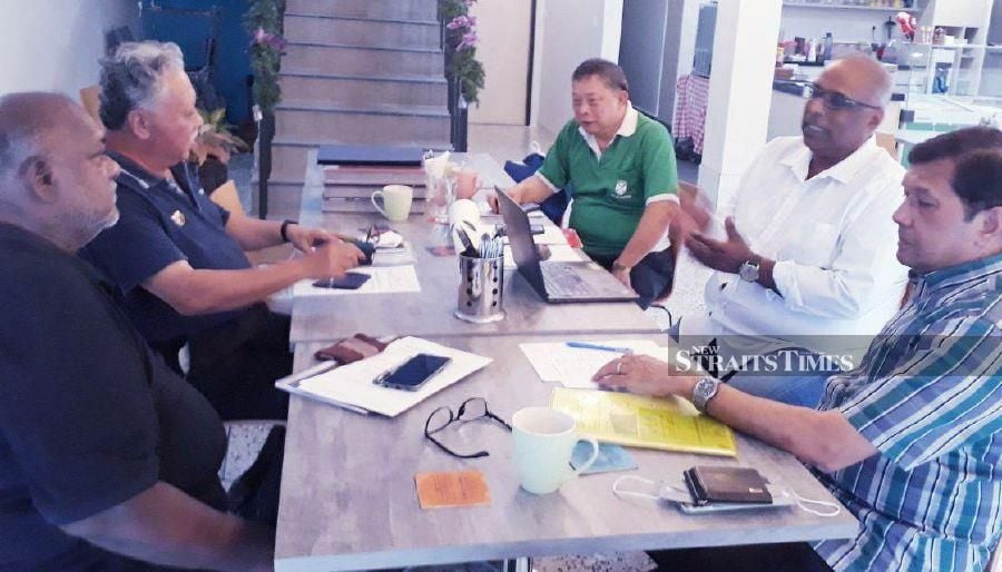 (From left) Paramjothy Kandiah, James Sia, Bro Andrew Loke, V. Nanda Kumar and Micheal Simon discussing plans for the 170th Gala Dinner in celebration of the La Salle Brothers in Malaysia. - NSTP/ADRIAN DAVID