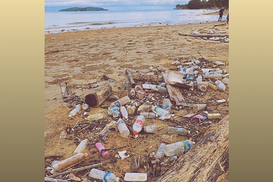 Plastic trash washed ashore on Tanjung Aru beach following the high tide phenomenon recently. - Pic courtesy of Writer