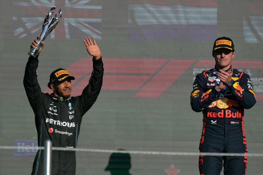 Mercedes' British driver Lewis Hamilton (left) and Red Bull Racing's Dutch driver Max Verstappen celebrate on the podium after the Formula One Mexico Grand Prix at the Hermanos Rodriguez racetrack in Mexico City on October 29, 2023. Verstappen won the race while Hamilton placed second. - AFP pic