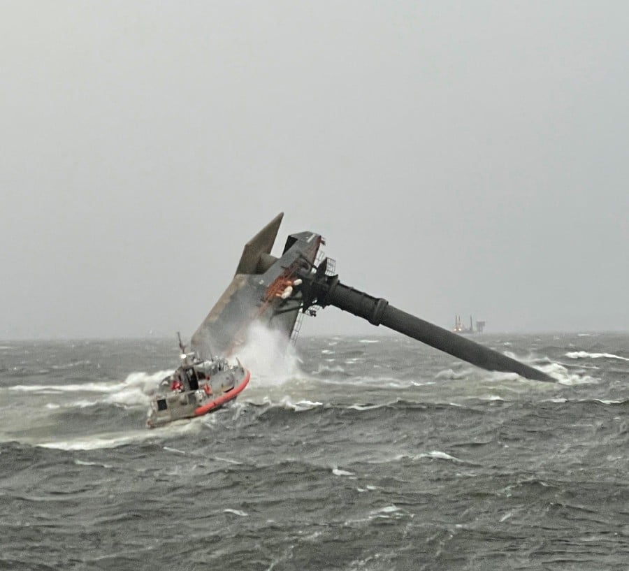 This US Coast Guard handout photo shows Coast Guard Station Grand Isle 45-foot Respone Boat-Medium boatcrew heading toward a capsized 175-foot commercial lift boat April 13, 2021 searching for people in the water 8 miles south of Grand Isle, Louisiana. -AFP pic/US Coast Guard