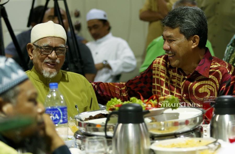(File pix) PAS President, Datuk Seri Abdul Hadi Awang (left) with UMNO deputy president Datuk Seri Mohamad Hasan at Kompleks PAS Negeri Sembilan, Seremban last night. Pix by NSTP/Iqmal Haqim Rosman 