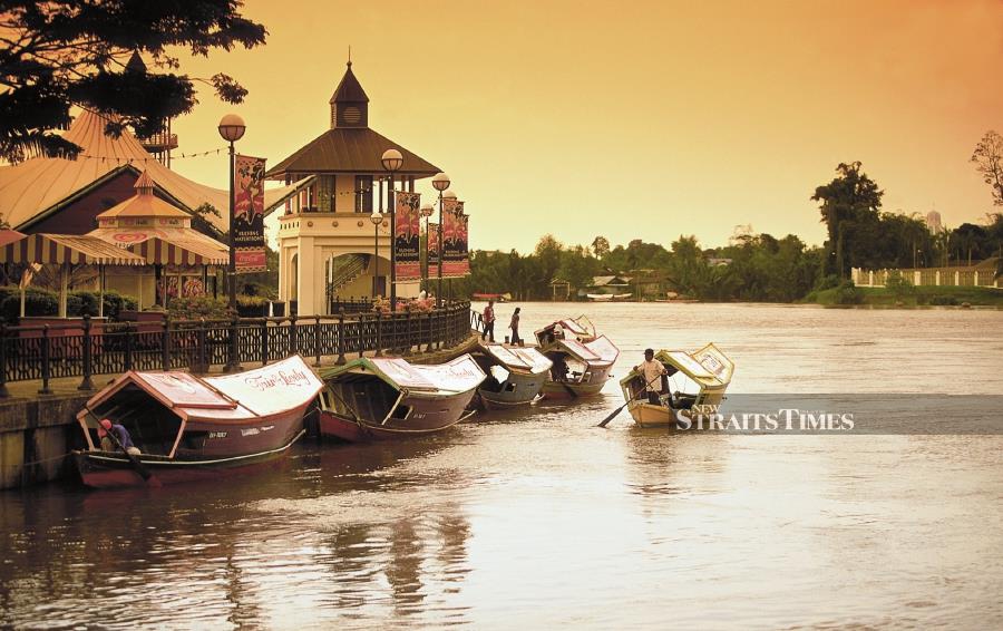 The vibrant Kuching waterfront lines the city side of the river while bumboats provide access to tourist attractions like the State Legislature building, Astana Negeri and Fort Margherita