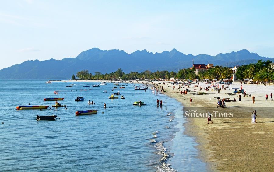 Pantai Cenang is close enough fo rthose who want to enjoy a dip in the Andaman Sea. Pictures by David Bowden.