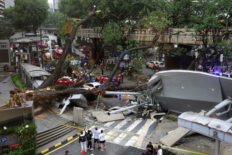Four monorail stations - Bukit Nanas, Raja Chulan, Bukit Bintang and Imbi - will be temporarily closed for cleaning and repair works after an uprooted tree smashed onto the monorail track today. - REUTERS pic