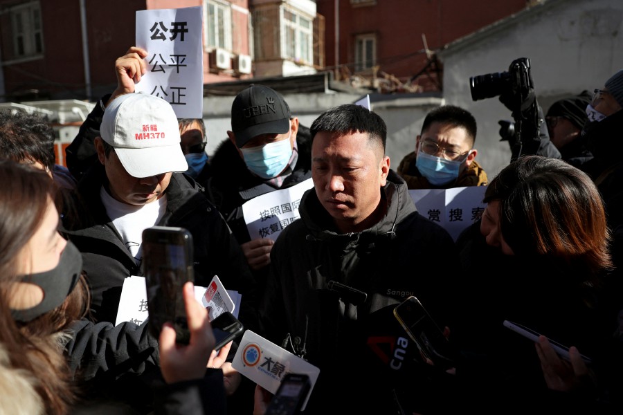 A man surnamed Fu, who lost his brother, reacts as he speaks to the media following a court hearing on compensation for those who lost their loved ones on the Malaysia Airlines flight MH370 that went missing in 2014, in Beijing, China November 27, 2023. REUTERS PIC