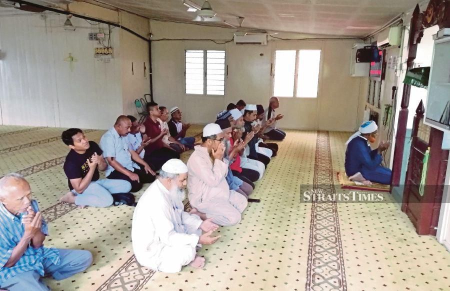 A congregation praying in the weathered 88-year-old mosque. 