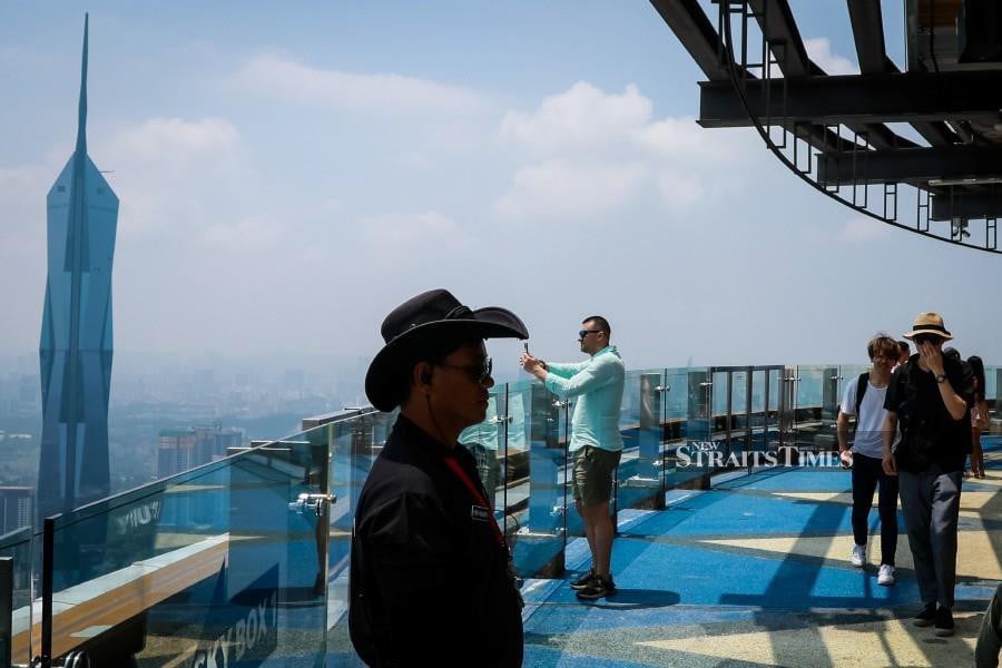 Tourist looking at Kuala Lumpur view from Kuala Lumpur tower. NSTP/ASYRAF HAMZAH