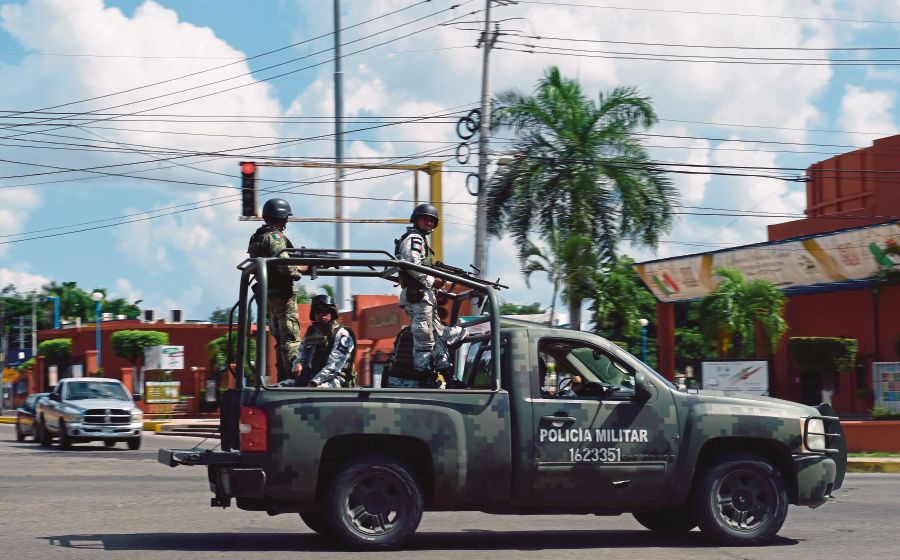Members of the National Guard patrol a street in Culiacan, Sinaloa state, Mexico, on October 18, 2019.-AFP