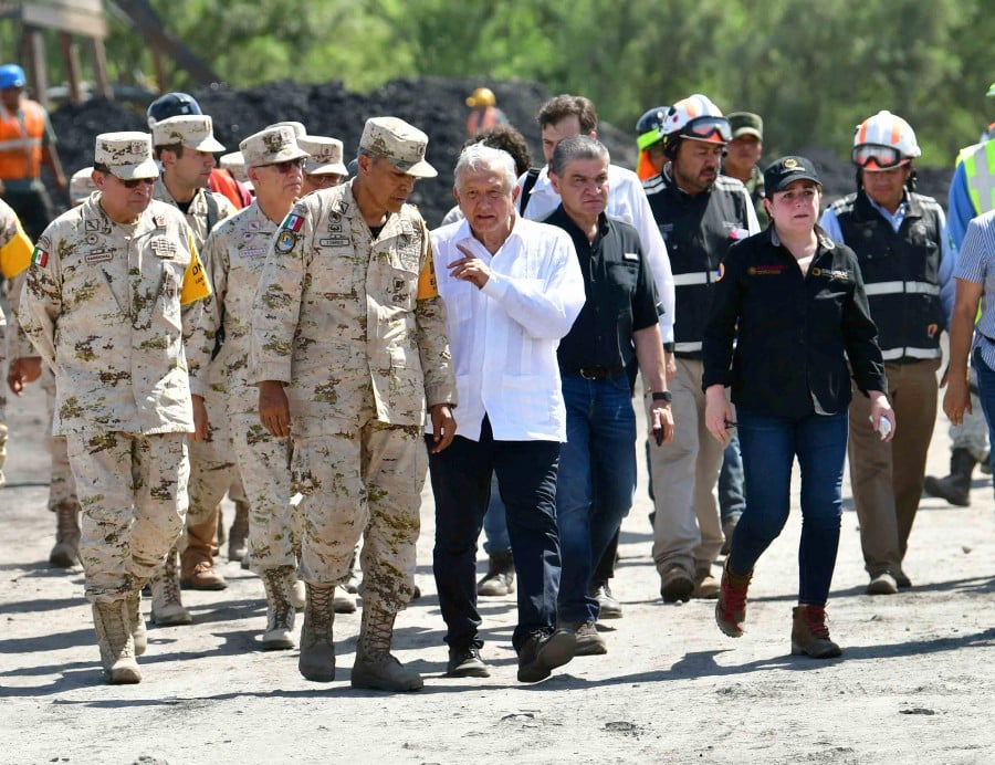 Mexico's President Andres Manuel Lopez Obrador visits a coal mine that collapsed leaving miners trapped in Sabinas, Coahuila state, Mexico. -Mexico Presidency/Handout via REUTERS 
