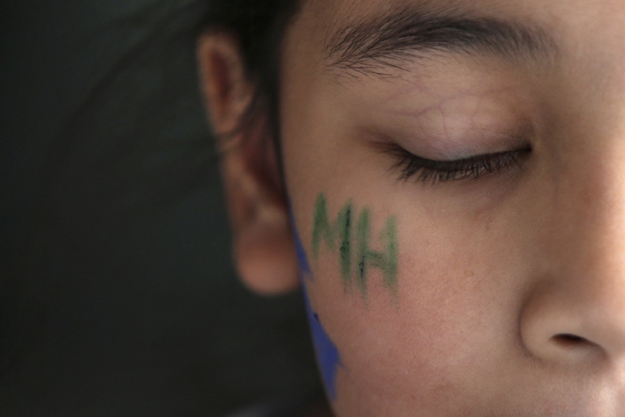 (File pix) A kid with the letters 'MH370' painted on his cheek gestures during a remembrance ceremony to mark the third anniversary of the Malaysia Airlines MH370 plane's disappearance, in Kuala Lumpur, Malaysia. Malaysian Airline System Berhad (MAS) together with Malaysia Airlines Berhad (MAB) today held a private remembrance ceremony at KL International Airport (KLIA) in memory of MH370. EPA Photo