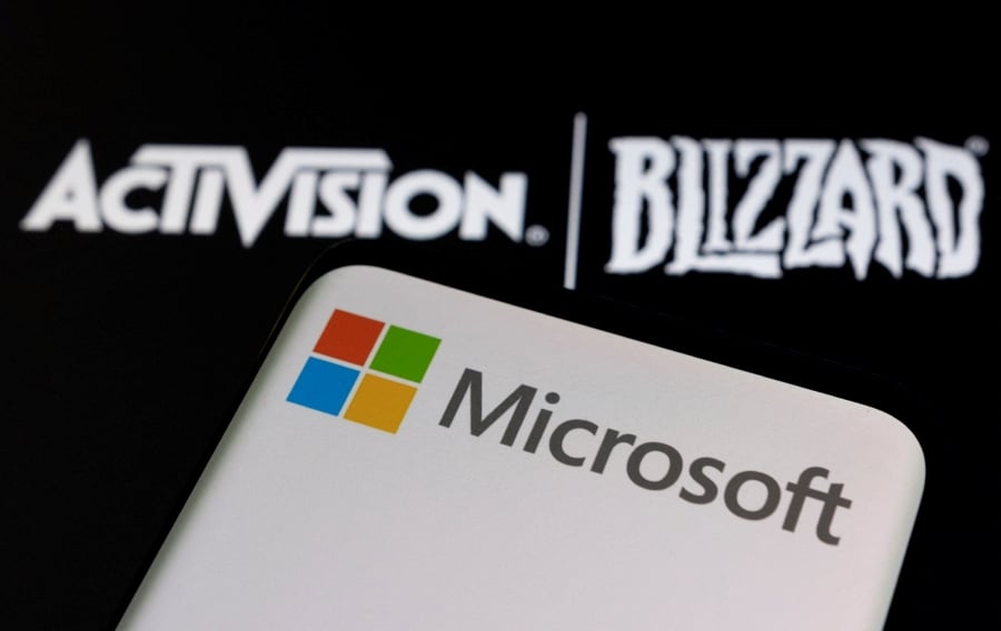 (FILE PHOTO) Microsoft is laying off 1,900 people, or eight per cent of staff, from its gaming division as it consolidates the blockbuster buyout of “Call of Duty” maker Activision Blizzard. (REUTERS/Dado Ruvic/Illustration/File Photo)