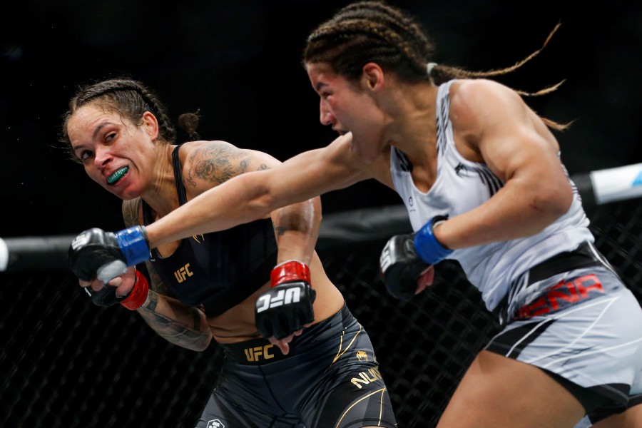 FILE - Julianna Pena, right, throws a right to Amanda Nunes during a women's bantamweight mixed martial arts title bout at UFC 269, Saturday, Dec. 11, 2021, in Las Vegas. Peña stunned pretty much everyone but herself when she took the bantamweight title from two-division champion Amanda Nunes in one of the biggest upsets in UFC history. - AP pic