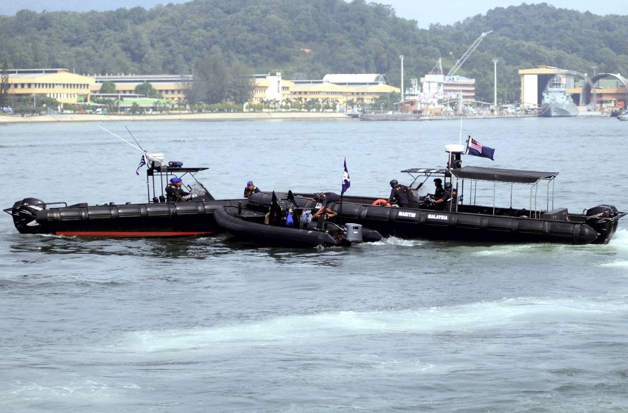 (STOCK PHOTO) Five people were detained by marine police here on Thursday night over illegal entry and assisting in illegal entry while they were en route to Kota Kinabalu via a speedboat .