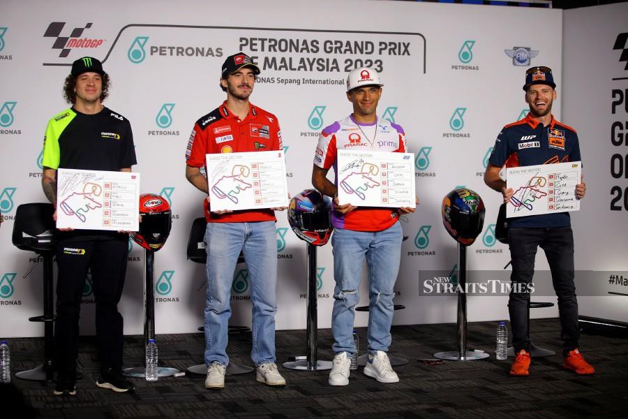 Marco Bezzecchi (left) is determined to continue chasing improvements at the Petronas Grand Prix of Malaysia which starts here tomorrow. - NSTP/OSMAN ADNAN 
