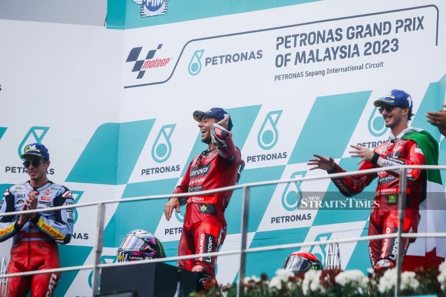 Enea Bastianini's (center) main race victory at the Petronas Grand Prix of Malaysia today could not have come at a better time. NSTP/OSMAN ADNAN 
