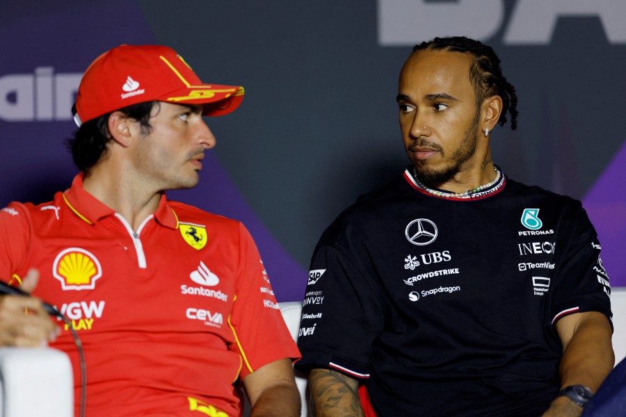 Ferrari's Carlos Sainz Jr. and Mercedes' Lewis Hamilton during a press conference ahead of the Bahrain Grand Prix. REUTERS PIC