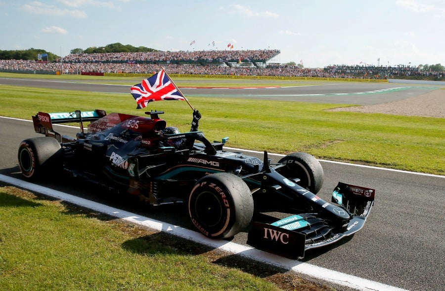Mercedes' Lewis Hamilton celebrates after winning the race. REUTERS FILE PIC