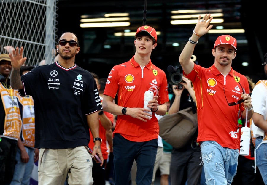 Mercedes' Lewis Hamilton, Ferrari's Charles Leclerc and Ferrari's Oliver Bearman during the drivers parade ahead of the race. REUTERS PIC