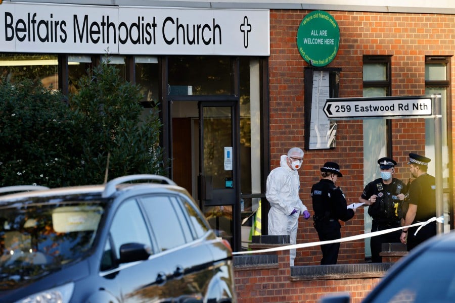 Police forensics officers work at the scene of a fatal stabbing incident at Belfairs Methodist Church in Leigh-on-Sea, a district of Southend-on-Sea, in southeast England on October 15, 2021. - Conservative British lawmaker David Amess was killed on Friday after being stabbed "multiple times" during an event in his local constituency in southeast England, in the second death of a UK politician while meeting voters since 2016. Local police did not name Amess but said a man had been arrested "on suspicion (of) murder" after the stabbing in Leigh-on-Sea.  - AFP pic