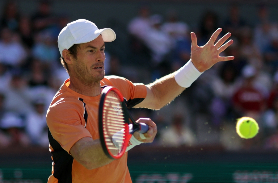 Andy Murray plays a forehand against Andrey Rublev in their second round match at Indian Wells. -- AFP