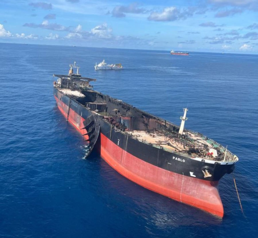 The forensic team from the Fire and Rescue Services Department, Police and Malaysian Maritime Enforcement Agency (MMEA) will identify the cause of the fire that broke out on board the oil tanker MT Pablo on May 1 (last Monday). - Pic courtesy of MMEA