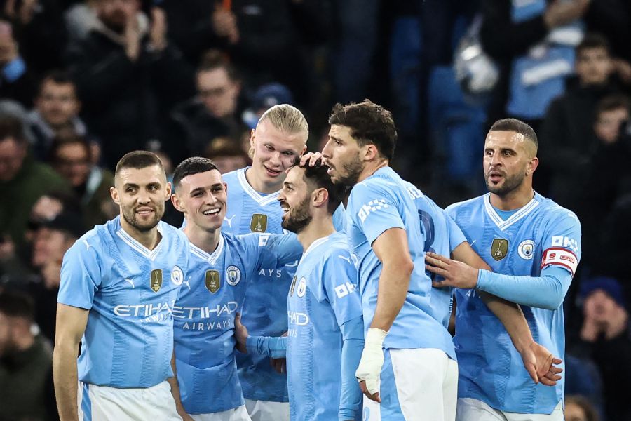 Manchester City's Portuguese midfielder #20 Bernardo Silva (C) celebrates with teammates after scoring his team second goal during the English FA Cup Quarter Final football match between Manchester City and Newcastle United at the Etihad Stadium in Manchester, north west England. - AFP file pic
