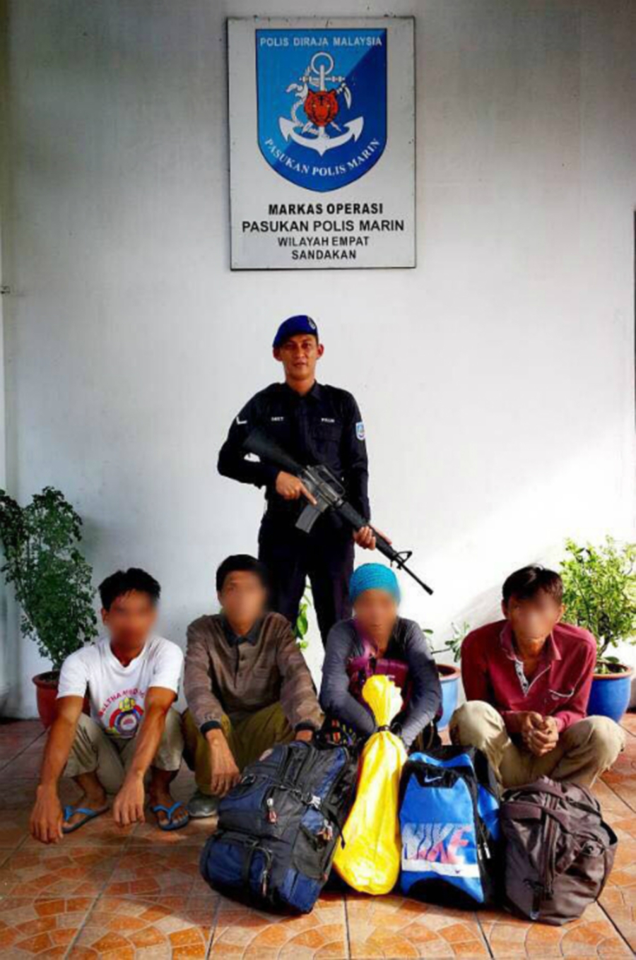 Marine police captured four foreigners attempting to enter the country illegally during an operation at Kuala Batu Tiga waters near here on Saturday.Pic by NSTP/Courtesy of Marine Police