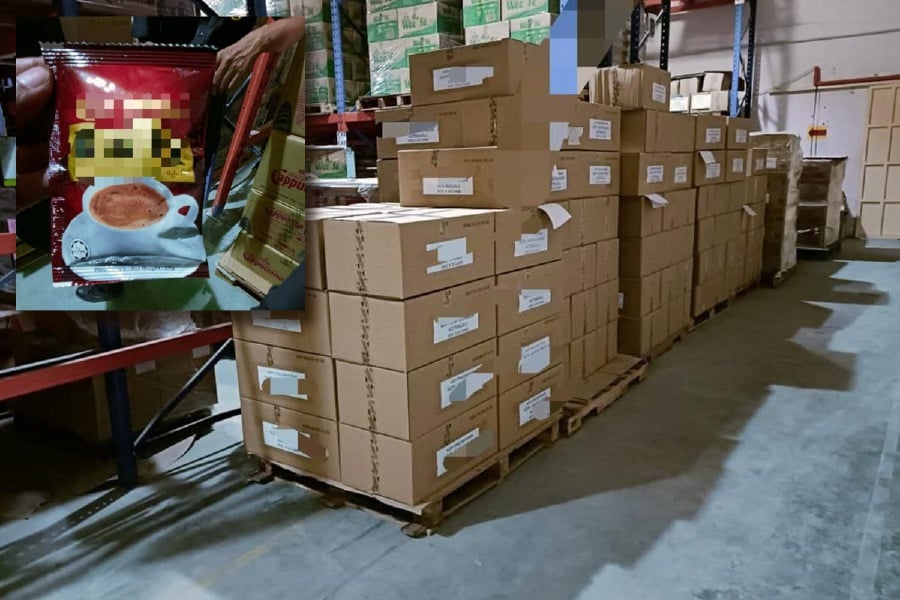 The Domestic Trade and Cost of Living Ministry seized 100,000 units of counterfeit pre-mixed coffee packets from a beverage processing factory and a storage premises in Mergong Industrial Area yesterday. - Pic courtesy of KPDN