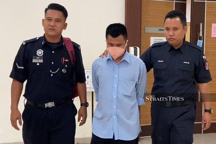 Mohd Fauzi Musa, 35, allegedly committed these acts against three of his male students in the library of a religious school in Tangkak in 2019 and 2020. He pleaded not guilty as all charges were read in front of Judge Abu Bakar Manat. - NSTP/ALIAS ABD RANI