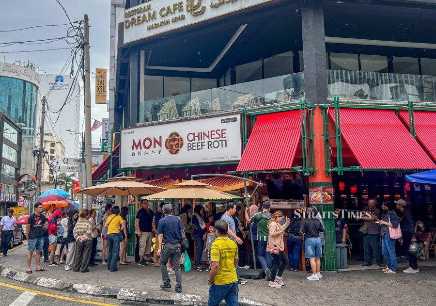 The Mon Chinese Beef Roti Restaurant management has admitted that they “overlooked” the issue of a staff member wearing a cross necklace, which went viral on social media recently. - NSTP/ AZIAH AZMEE