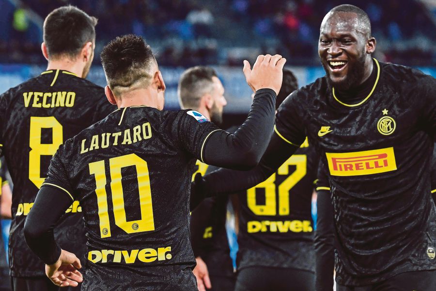 Lazio players cheer after scoring during the Italian Serie A