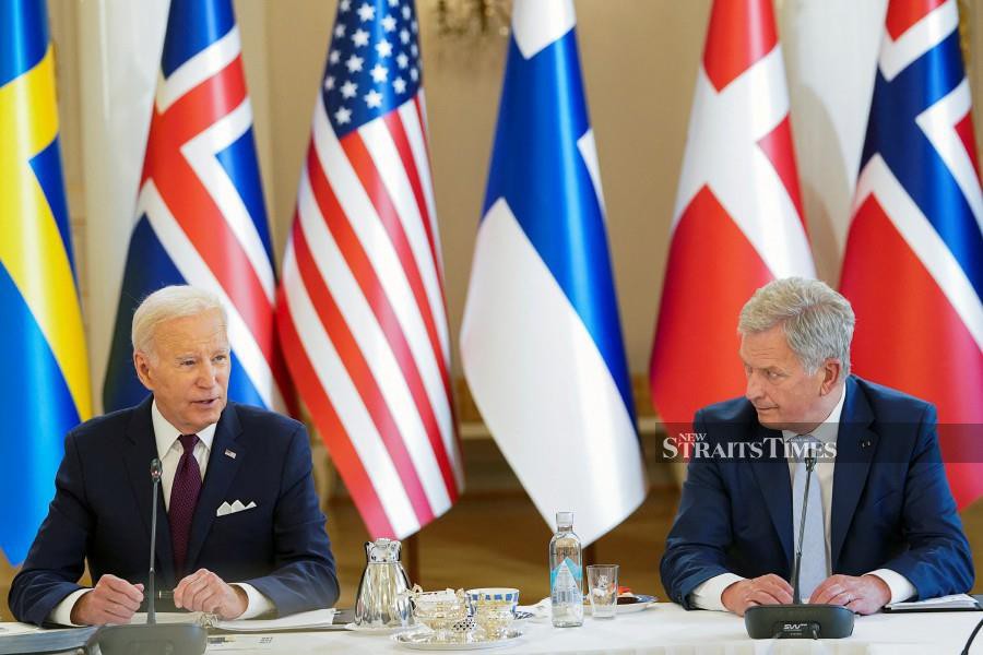 U.S. President Joe Biden sits next to Finland's President Sauli Niinisto, during a U.S.-Nordic Leaders meeting, in Helsinki, Finland, July 13, 2023. -REUTERS PIC