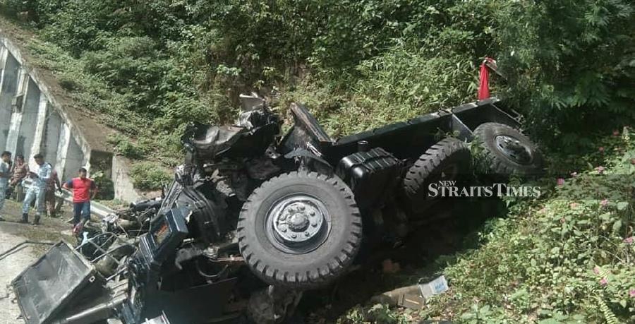 Three navy personnel were killed, while another was injured when the truck they were travelling in skidded and crashed at Jalan Ranau-Tamparuli near Kampung Bundu Tuhan, here, today. - NSTP/Courtesy of NST reader