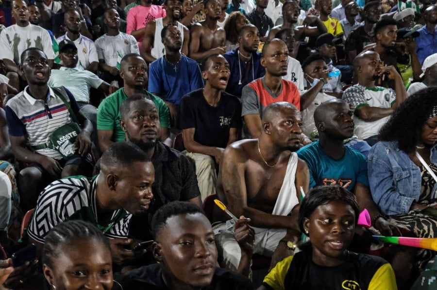 Nigeria supporters react as they watch the Africa Cup of Nations (CAN) 2024 final football match between Ivory Coast and Nigeria that is played in Ivory Coast, at the Onikan stadium in Lagos. - AFP pic