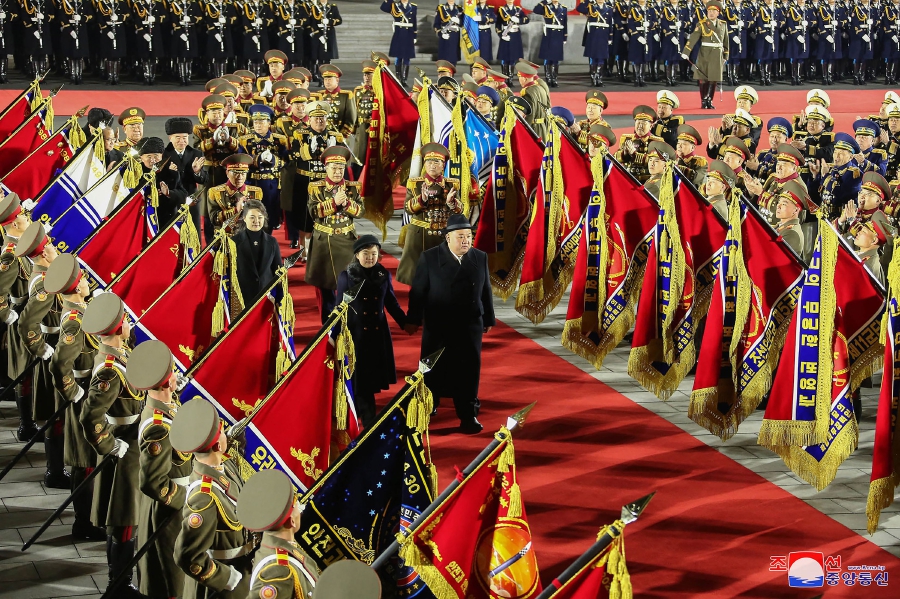 North Korea's leader Kim Jong Un (centre, right) inspecting a guard of honour with his daughter presumed to be named Ju Ae (centre) and wife Ri Sol Ju (centre, left) during a military parade celebrating the 75th anniversary of the founding of the Korean People's Army in Kim Il Sung Square in Pyongyang. (Photo by KCNA VIA KNS / AFP) 