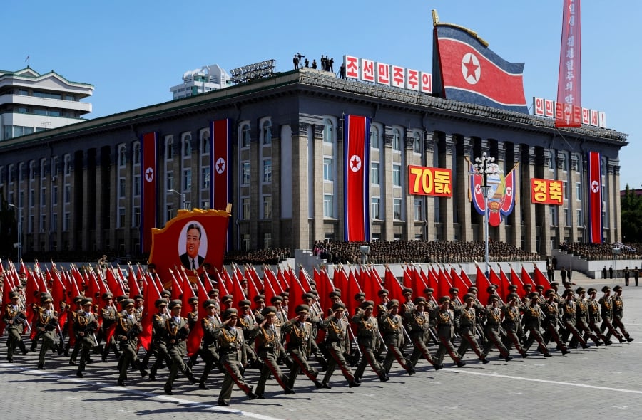 (FILE PHOTO) Soldiers march with the portrait of North Korean founder Kim Il Sung during a military parade marking the 70th anniversary of country's foundation in Pyongyang, North Korea. (REUTERS/Danish Siddiqui/File Photo)