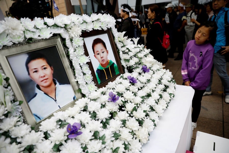It was sad enough when the bodies of Han Sung Ok and her 6-year-old son were found in their US$74 (RM309)-a-month apartment in Seoul in July, two months after they had died. -- Reuters photo