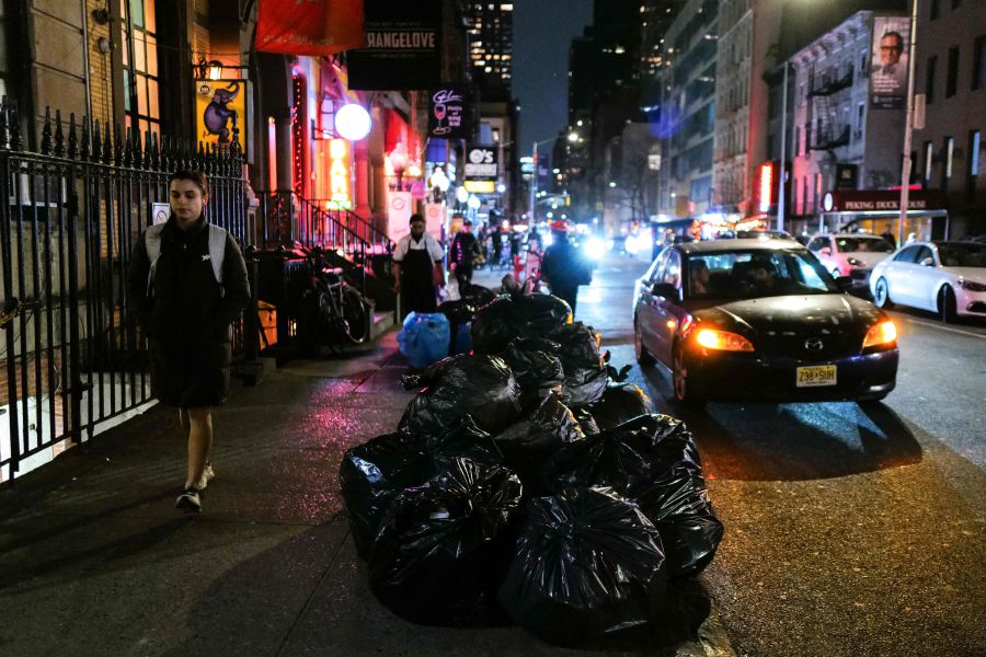 A woman walks past a pile of garbage bags in the Manhattan borough of New York. The mountains of black bags of garbage that invade New York's sidewalks for rats to feast on will soon be history. The city has begun introducing a garbage can system to clean up the streets and starve its rodent army. Residents have until 2026 to adapt to the type of containers, which are inspired by cities such as Barcelona, Madrid or Buenos Aires. New York has begun to implement in a pilot program in the Harlem neighborhood of Manhattan. - AFP pic