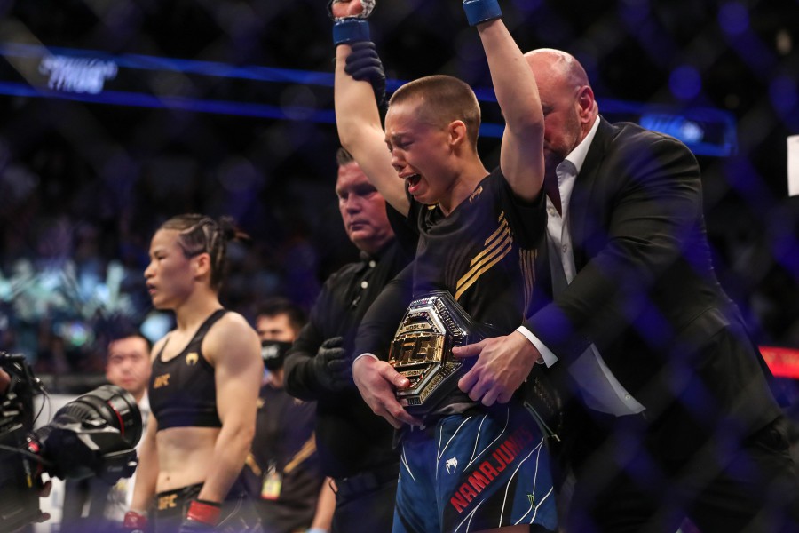 Rose Namajunas celebrates after beating Zhang Weili (left) during the Women's Strawweight Title bout of UFC 261 at VyStar Veterans Memorial Arena in Jacksonville, Florida. - AFP pic