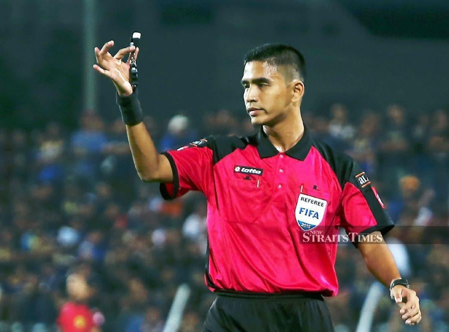 Nazmi Nasaruddin, who is rated as one of Malaysia's top referees, is surprised by the enthusiasm shown by his peers in the use of the Video Assistant Referee (VAR) system, for the first time, for the 2024-2025 M-League. - NSTP file pic