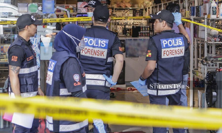 This file pic dated June 14, 2023, shows forensic police officers at the crime scene in Bandar Sunway, Subang Jaya. - NSTP/AIZUDDIN SAAD
